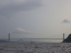Ahead, the George Washington Bridge, and beyond it the city, reappear out of the fog