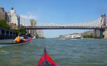 In the Manhattan-side channel past Roosevelt Island, with the Queensboro Bridge ahead
