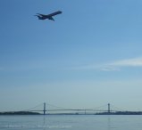 Overhead, planes come in to land at LaGuardia