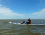 We paddle against the increasing headwind through the shallows at the mouth of the Broad River